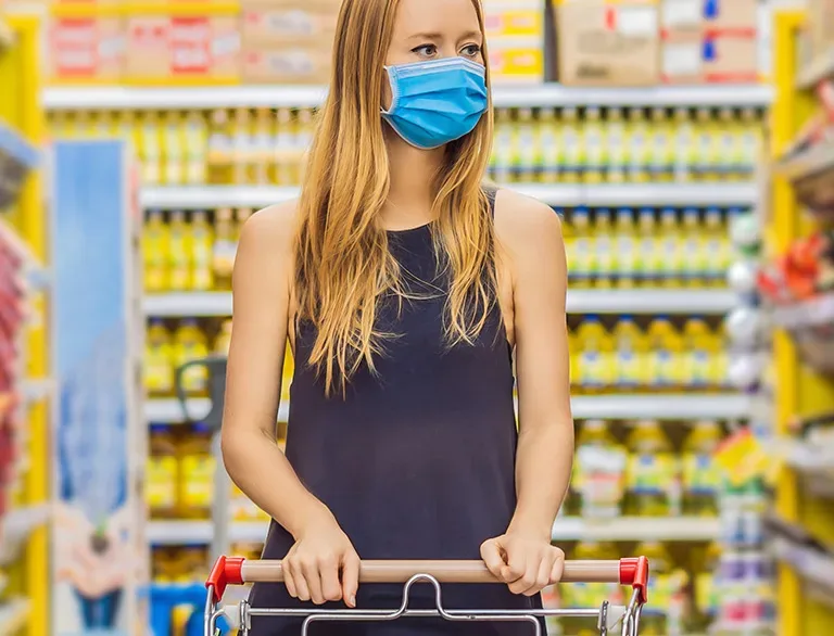 woman in grocery store with mask